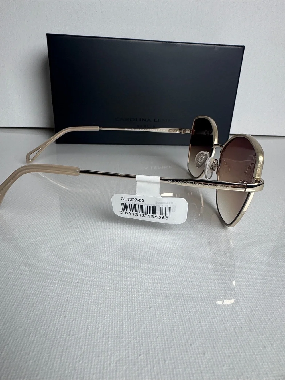 Carolina Herrera Gold Frame Sunglasses with Brown Gradient Lenses